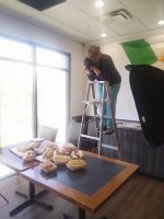 Picture of photographer photographing in a restaurant
