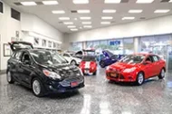 Interior of a auto dealership showroom.
