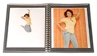 A fashion model's portfolio book showing her modeling work.