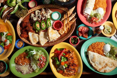 A table full of colorful Mexican foods